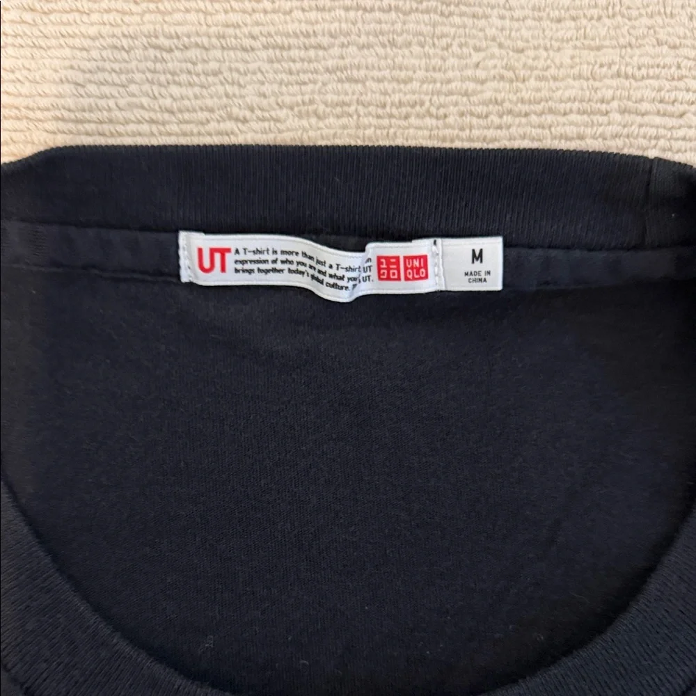 Uniqlo Black One Piece Graphic Tee with White Slogan - Picture 2 of 4